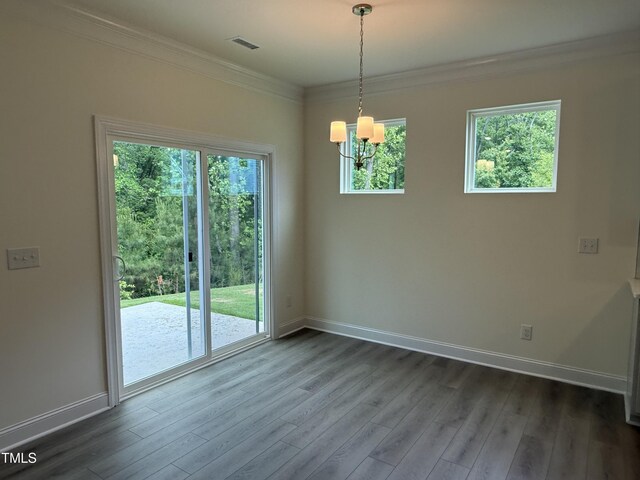 129 Stallion Way, Benson, NC 27504 - unfurnished dining area featuring a chandelier, baseboards, dark wood finished floors, and crown molding