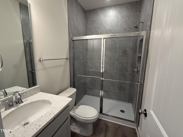129 Stallion Way, Benson, NC 27504 - full bath featuring wood finished floors, a stall shower, toilet, and vanity