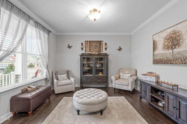 living area featuring plenty of natural light, dark hardwood / wood-style floors, and ornamental molding