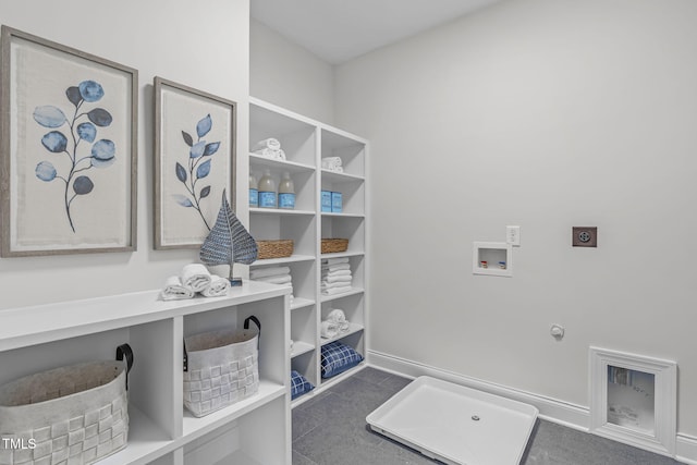 clothes washing area featuring laundry area, baseboards, hookup for a gas dryer, hookup for a washing machine, and hookup for an electric dryer