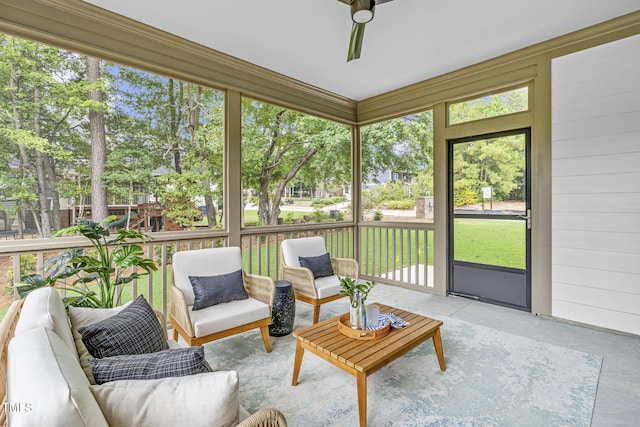 sunroom featuring a ceiling fan