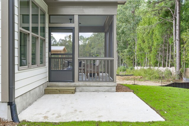 entrance to property featuring a patio area