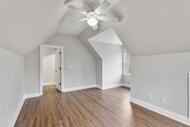 additional living space featuring ceiling fan, vaulted ceiling, and dark hardwood / wood-style floors