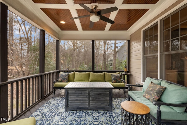 unfurnished sunroom with coffered ceiling, a healthy amount of sunlight, ceiling fan, and wood ceiling