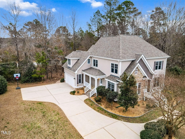 view of front of house with a garage and a front lawn