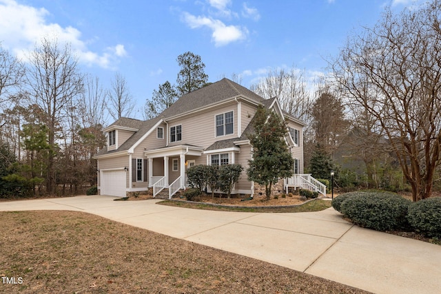 view of property with a garage and a front yard