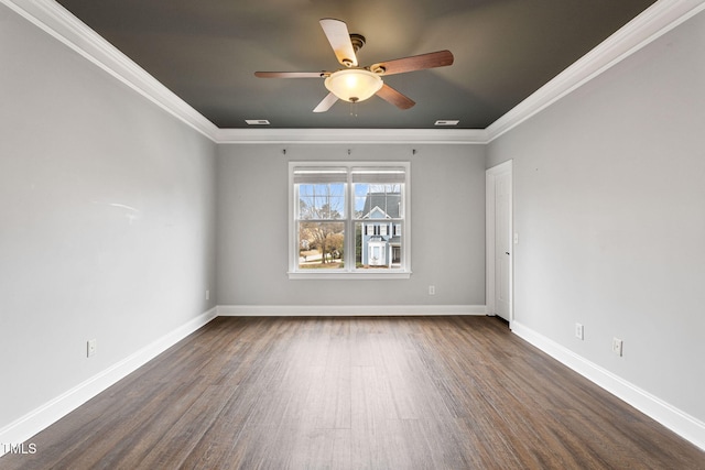 spare room featuring dark wood-type flooring, ceiling fan, and ornamental molding