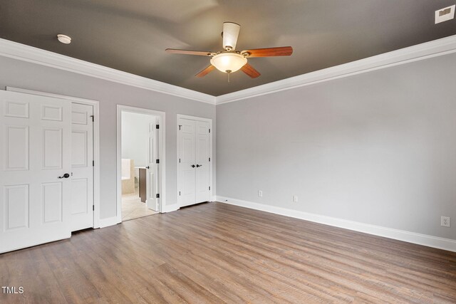 unfurnished bedroom featuring ceiling fan, hardwood / wood-style flooring, and ornamental molding