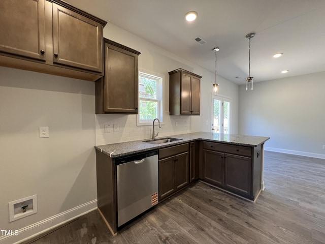 286 Longbow Dr, Middlesex, NC 27557 - kitchen with a sink, dishwasher, dark wood finished floors, a peninsula, and light stone countertops