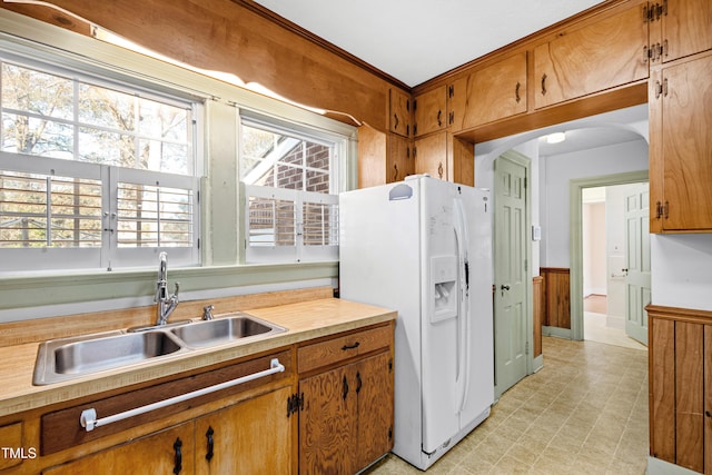 kitchen with white fridge with ice dispenser and sink