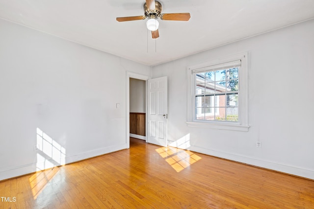 empty room featuring ceiling fan and light hardwood / wood-style floors