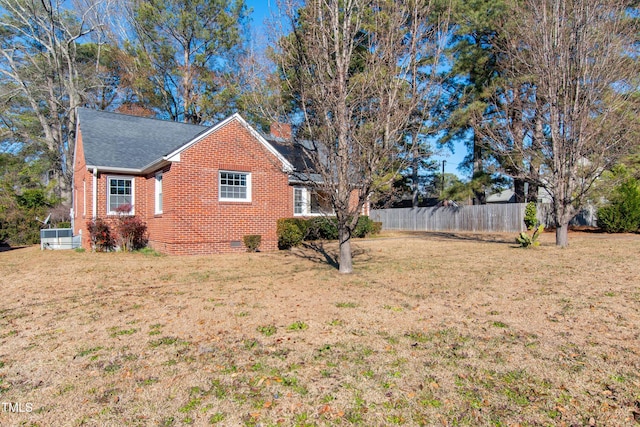 view of property exterior with a yard