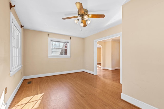 spare room with ceiling fan and light hardwood / wood-style floors