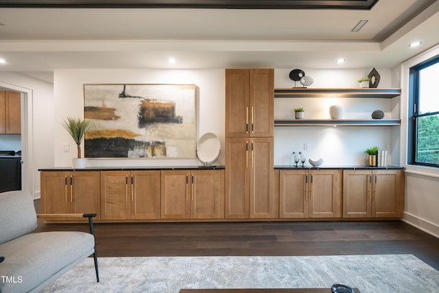 bar with dark hardwood / wood-style floors