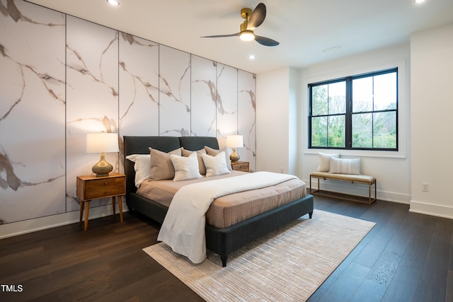 bedroom featuring dark hardwood / wood-style floors and ceiling fan