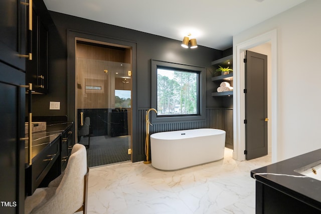 bathroom featuring vanity and shower with separate bathtub