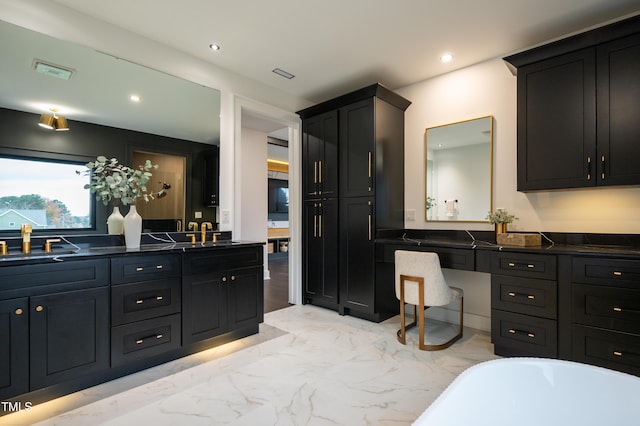 bathroom featuring a bathtub and vanity