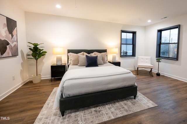 bedroom featuring dark wood-type flooring