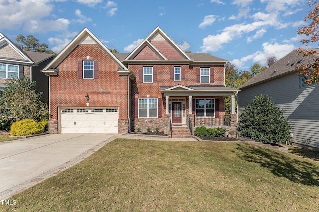 craftsman-style house featuring a porch, a garage, and a front yard