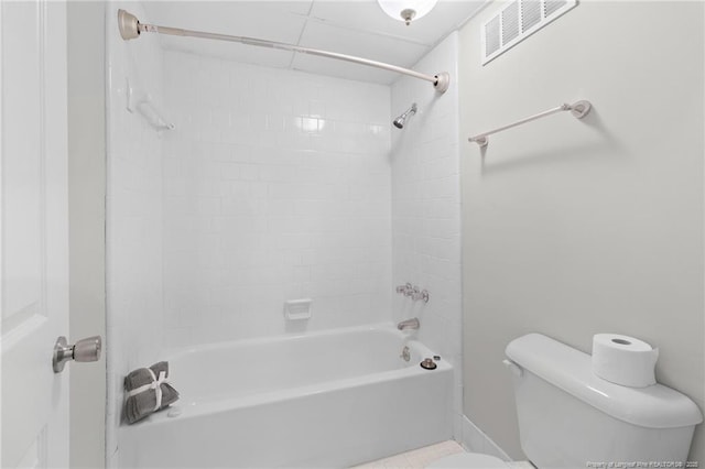 bathroom with washtub / shower combination and toilet