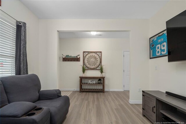 living area featuring light hardwood / wood-style floors