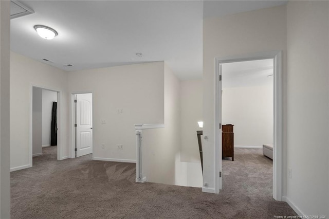 hallway featuring carpet flooring