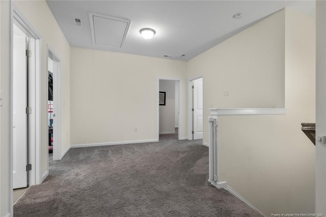 empty room with dark carpet