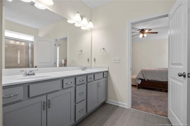 bathroom with a shower, ceiling fan, and vanity