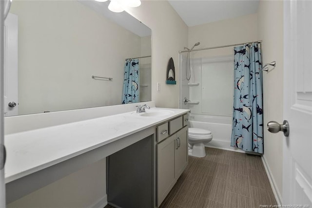 full bathroom with toilet, vanity, and shower / tub combo with curtain