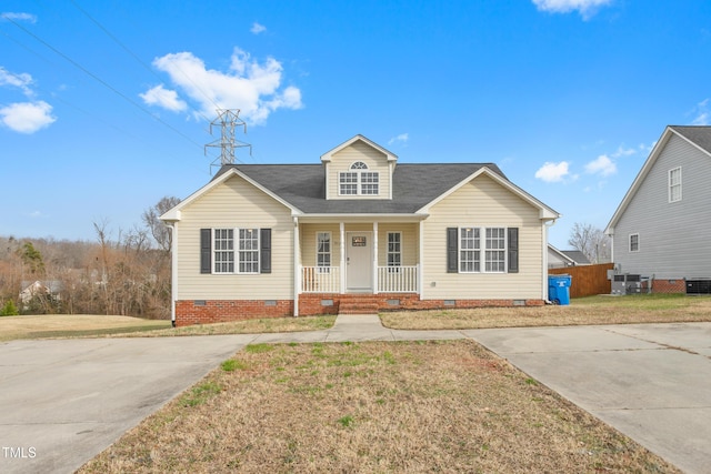 view of front facade featuring central AC, a front lawn, and a porch