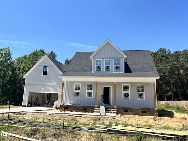 view of front of house with crawl space, covered porch, fence, and driveway