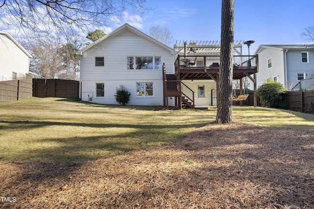 back of house featuring a deck, a yard, and a pergola