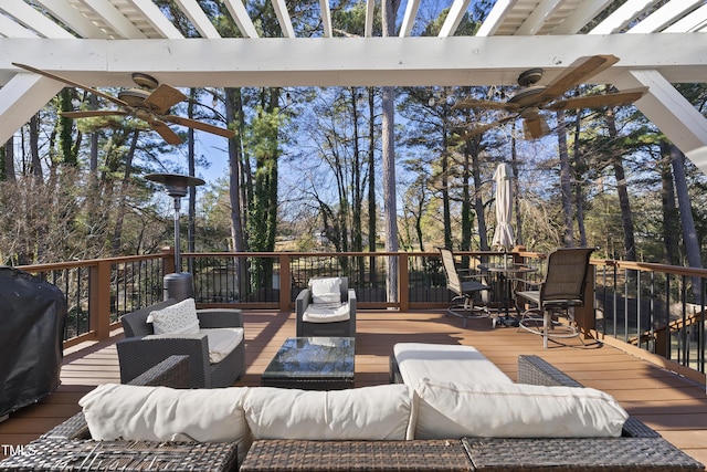 deck with ceiling fan, an outdoor hangout area, a pergola, and grilling area