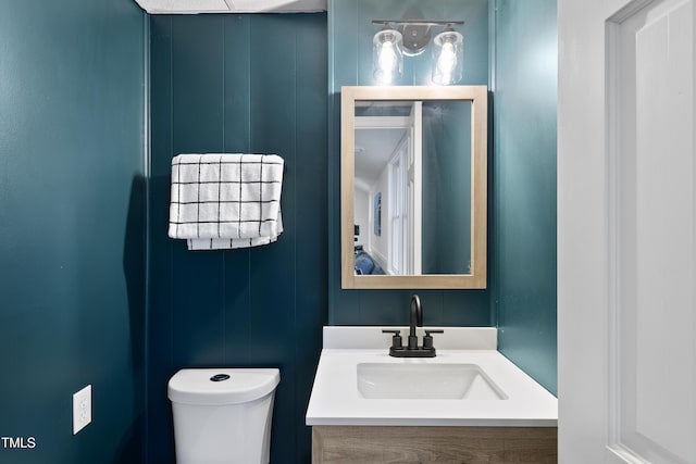 bathroom with toilet and vanity