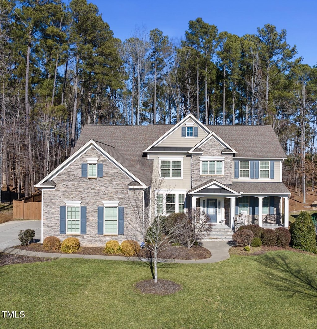 view of front of house with a front lawn and covered porch