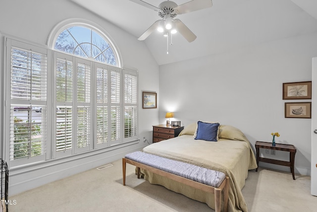 carpeted bedroom featuring ceiling fan and vaulted ceiling