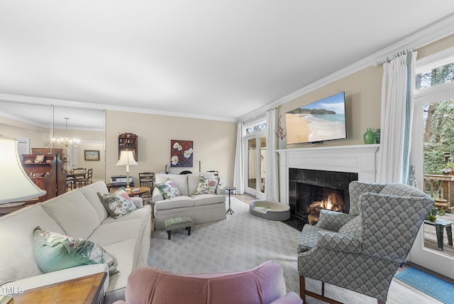 living room featuring ornamental molding and a chandelier