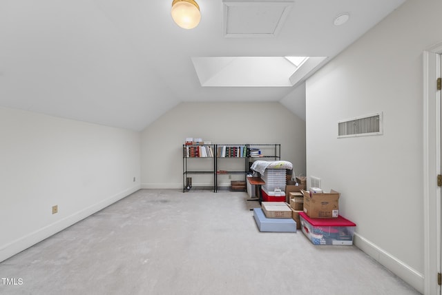 interior space featuring vaulted ceiling and carpet floors