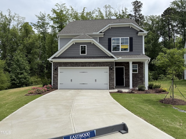 137 Stallion Way, Benson, NC 27504 - craftsman-style house featuring driveway, a front lawn, stone siding, an attached garage, and a shingled roof