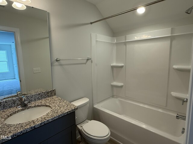 137 Stallion Way, Benson, NC 27504 - full bathroom with lofted ceiling, toilet, vanity, and shower / washtub combination