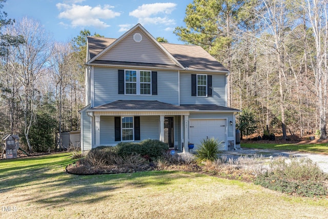 view of property with covered porch, a garage, and a front lawn