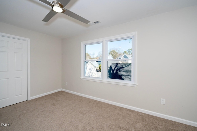 unfurnished bedroom featuring ceiling fan and light colored carpet