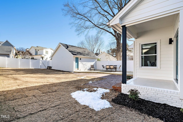 view of yard featuring an outbuilding and a patio