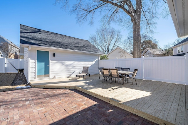 back of house with a wooden deck