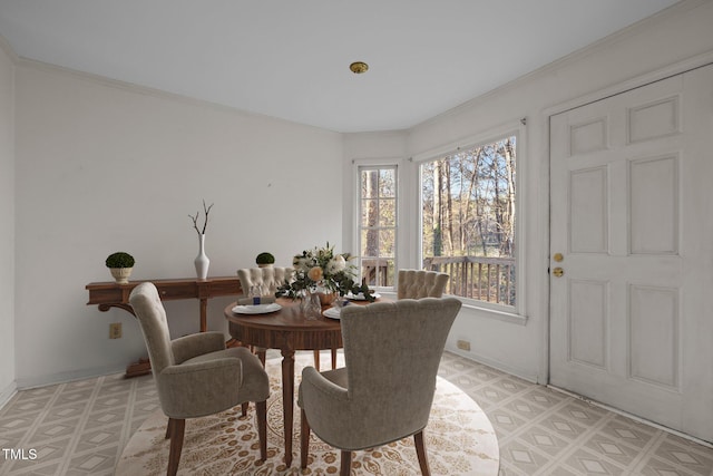 dining area featuring ornamental molding