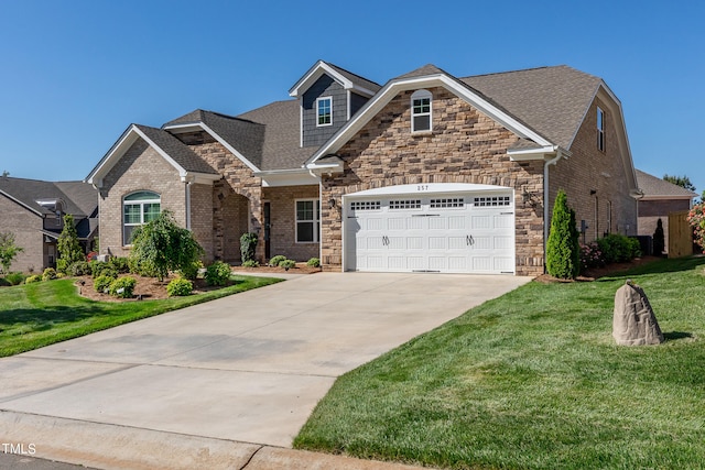 view of front of house featuring a front yard and a garage