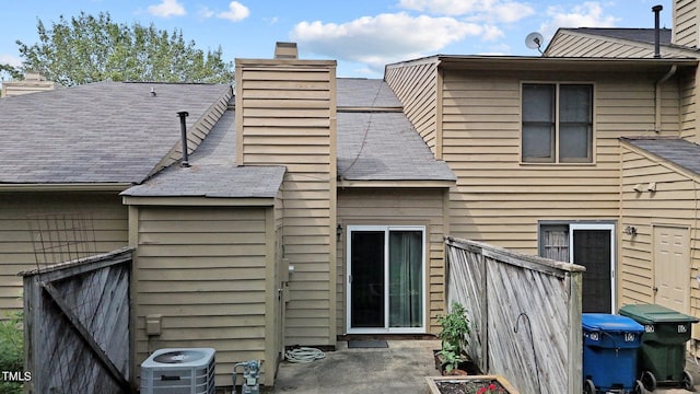 back of house featuring central AC unit and a patio area