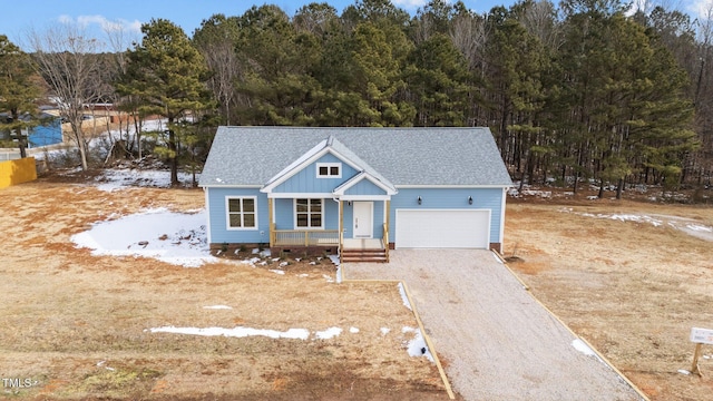 view of front of property featuring a garage and covered porch