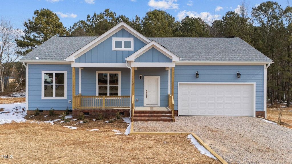 view of front of home with a garage and covered porch