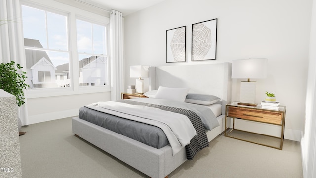 bedroom featuring baseboards and carpet